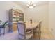 Formal dining room featuring a white dining set and a display cabinet at 20326 Merry Oak Ave, Tampa, FL 33647