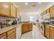 Spacious kitchen featuring modern appliances, ample countertop space, and seamlessly connects to the living area at 20326 Merry Oak Ave, Tampa, FL 33647