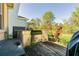 Outdoor kitchen with a stainless steel BBQ grill, mounted in a wooden cabinet on an exposed wooden deck at 20326 Merry Oak Ave, Tampa, FL 33647