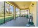 Screened patio offering a relaxing outdoor space, with fan, view of the backyard, and ample space for activities at 20326 Merry Oak Ave, Tampa, FL 33647