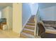 Carpeted staircase with white railing and wood flooring landing at 20326 Merry Oak Ave, Tampa, FL 33647