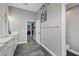 A well-designed bathroom featuring modern fixtures, tile flooring, and an entrance to the walk-in closet at 20849 Cedar Bluff Pl, Land O Lakes, FL 34638