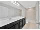 Bathroom with double sinks, undermount sinks, shower, and mirror at 2109 Laceflower Dr, Brandon, FL 33510