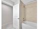 Bathroom featuring a shower-tub combo with tile surround and neutral paint at 2109 Laceflower Dr, Brandon, FL 33510