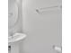 This bathroom features a pedestal sink with a chrome faucet, a towel bar, and a toilet paper holder at 2109 Laceflower Dr, Brandon, FL 33510