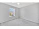 Bright, carpeted bedroom with a large window and ceiling fan providing ample natural light at 2109 Laceflower Dr, Brandon, FL 33510