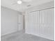 Neutral bedroom featuring light gray carpet, large closet and a ceiling fan at 2109 Laceflower Dr, Brandon, FL 33510
