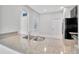 Modern kitchen showcasing granite countertops with a stainless steel sink and black appliances at 2109 Laceflower Dr, Brandon, FL 33510