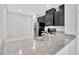 Kitchen features granite countertops with a stainless steel sink, black appliances, and ample cabinet space at 2109 Laceflower Dr, Brandon, FL 33510