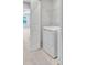 Convenient laundry area with washer, dryer, and shelving for organized storage at 2109 Laceflower Dr, Brandon, FL 33510