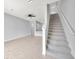 This living room has hard surface flooring and carpeted stairs at 2109 Laceflower Dr, Brandon, FL 33510