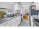 Kitchen with a stainless steel sink, granite countertop and a refrigerator in the background at 2145 8Th N Ave, St Petersburg, FL 33713