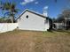 Backyard view highlighting the home's architecture and outdoor living space at 2218 Egret Walk Ct, New Port Richey, FL 34655