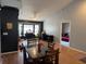 Open-concept living room with hardwood floors, large windows, and stylish black accent wall at 2218 Egret Walk Ct, New Port Richey, FL 34655