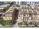 Aerial view of multi-story townhomes with private back patios and well-maintained landscaping at 2240 Soho Bay Ct, Tampa, FL 33606