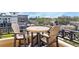 Outdoor balcony seating area with a table and chairs overlooking the city at 2240 Soho Bay Ct, Tampa, FL 33606