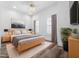 Bedroom offering a bright ambiance, wood floors, and large windows at 2240 Soho Bay Ct, Tampa, FL 33606