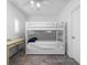 This bedroom features a bunk bed, study desk, and natural lighting at 2240 Soho Bay Ct, Tampa, FL 33606