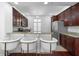 Eat-in kitchen with stainless steel appliances, granite countertops, and breakfast bar at 2240 Soho Bay Ct, Tampa, FL 33606