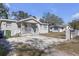 Exterior shot of a cozy single Gathering house with a small front porch and gravel landscaping at 2308 Chipco St, Tampa, FL 33605