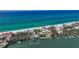 Stunning aerial view of a beachfront home with lush landscaping and private beach access at 2411 And 2407 Casey Key Rd, Nokomis, FL 34275