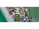 Aerial shot of a beach house featuring a pool, putting green, and convenient beach and water access at 2411 And 2407 Casey Key Rd, Nokomis, FL 34275