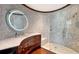 Elegant bathroom featuring a curved vanity with marble countertop, modern fixtures, and a frameless glass shower at 2411 And 2407 Casey Key Rd, Nokomis, FL 34275