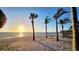 Beautiful sandy beach with palm trees and oceanfront hammock at sunset at 2411 And 2407 Casey Key Rd, Nokomis, FL 34275