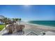 Breathtaking beach view with white sand, turquoise water, and palm trees at 2411 And 2407 Casey Key Rd, Nokomis, FL 34275