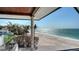 Balcony view of sandy beach and tranquil ocean at 2411 And 2407 Casey Key Rd, Nokomis, FL 34275