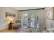 Cozy breakfast nook with a glass table, chairs, and natural light at 2411 And 2407 Casey Key Rd, Nokomis, FL 34275