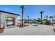 Beautiful courtyard with palm trees, outdoor seating, and stone pavers leading to the beach at 2411 And 2407 Casey Key Rd, Nokomis, FL 34275