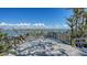 Spacious deck with wooden railings and tranquil water views at 2411 And 2407 Casey Key Rd, Nokomis, FL 34275