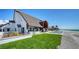 Stunning home with a pool, manicured lawn, beachfront access, and an outdoor lounge area for relaxing by the sea at 2411 And 2407 Casey Key Rd, Nokomis, FL 34275