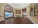 Elegant foyer with dark wood floors, neutral walls, and ocean view access through large sliding glass doors at 2411 And 2407 Casey Key Rd, Nokomis, FL 34275