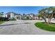 Stunning luxury home featuring a circular driveway, manicured lawn, and exquisite architectural details at 2411 And 2407 Casey Key Rd, Nokomis, FL 34275
