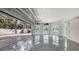 Bright and airy garage with epoxy floors and roll up door, perfect for car storage at 2411 And 2407 Casey Key Rd, Nokomis, FL 34275