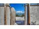 A weathered wooden gate opens to a glimpse of the water beyond at 2411 And 2407 Casey Key Rd, Nokomis, FL 34275