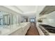 Modern kitchen featuring a large island with a farmhouse sink and stainless steel appliances at 2411 And 2407 Casey Key Rd, Nokomis, FL 34275