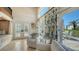 Bright living space boasts tropical views, stylish decor, and cozy seating at 2411 And 2407 Casey Key Rd, Nokomis, FL 34275