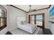 Tranquil main bedroom with ocean view, a cozy bed and a ceiling fan at 2411 And 2407 Casey Key Rd, Nokomis, FL 34275
