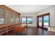 Elegant office with built-in bookcase, carved desk, and stunning ocean view at 2411 And 2407 Casey Key Rd, Nokomis, FL 34275
