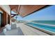 Gorgeous outdoor pool with ocean views and white seating for relaxing at 2411 And 2407 Casey Key Rd, Nokomis, FL 34275