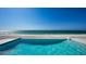 Beautiful infinity pool overlooking the ocean, providing a luxurious and serene experience at 2411 And 2407 Casey Key Rd, Nokomis, FL 34275