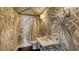 Stylish powder room with palm-themed wallpaper, marble countertop, chrome fixtures, and elegant lighting at 2411 And 2407 Casey Key Rd, Nokomis, FL 34275