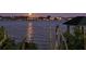Scenic water view featuring moonlight reflecting on the river and homes in the distance at 2411 And 2407 Casey Key Rd, Nokomis, FL 34275
