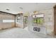 Renovated interior featuring a sink station, exposed framing, peeling walls, and concrete flooring, presenting a blank canvas at 2506 Mabry St, Tampa, FL 33618