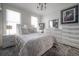 Stylish bedroom with a modern design, featuring a comfortable bed, elegant furnishings, and ample storage at 2921 W El Prado Blvd, Tampa, FL 33629