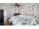 Bright bedroom featuring a leafy ceiling fan, hardwood floors, and plenty of natural light at 2921 W El Prado Blvd, Tampa, FL 33629