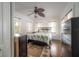 Bright bedroom featuring a leafy ceiling fan, hardwood floors, and plenty of natural light at 2921 W El Prado Blvd, Tampa, FL 33629